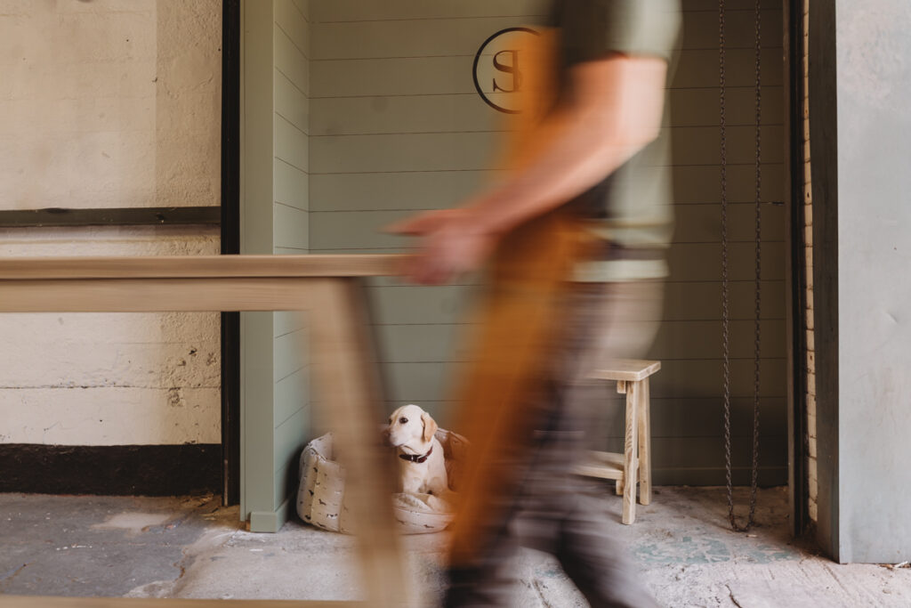 slow shutter image of a man carrying furniture 
