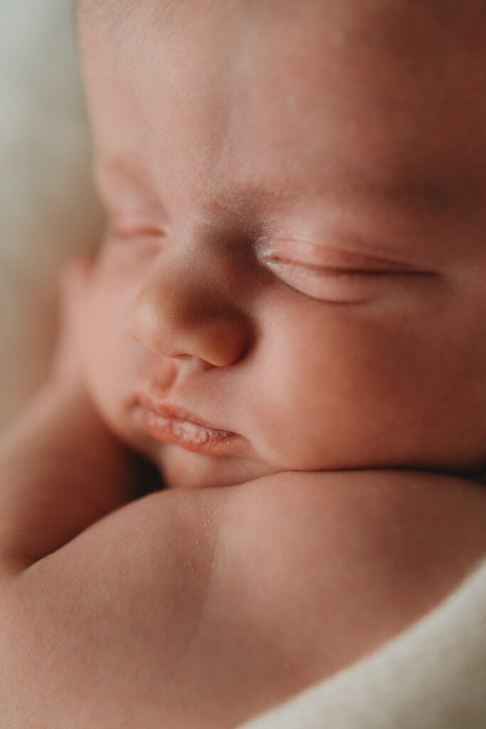 close up photo of sleeping newborn baby's face
